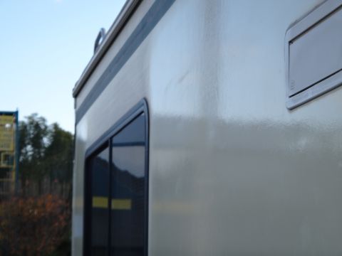 1995 Chevrolet P30 1 Ton - Step Van - Side view of a light-colored step van with a dark stripe along the top edge. A dark-rimmed window is visible on the left side of the vehicl…