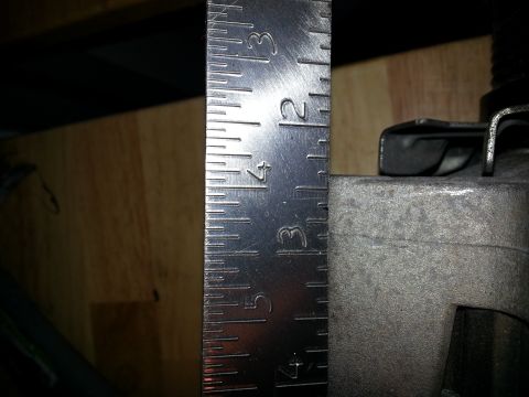 1994 Ford Bronco - A ruler measures a metal component, with the Supermotors.net logo visible at the bottom right.