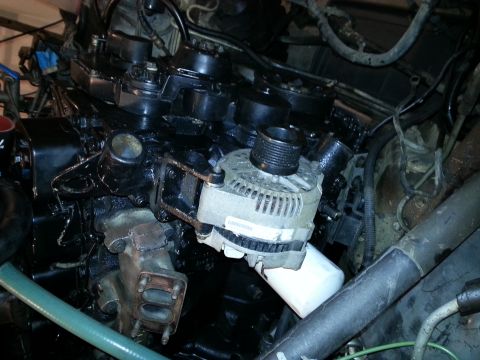 1994 Ford Bronco - Close-up view of an engine bay, showing various components and wiring.