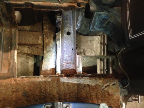 1979 Ford Bronco - This image shows the heavily rusted and corroded frame and body structure of what appears to be the lower section of a vehicle, possibly a…