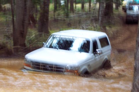 1996 Ford Bronco - Thought I'd be nice and leave as much water in the hole as posible, so I just crawled through nice an slow. Later made a momentum run at it…
