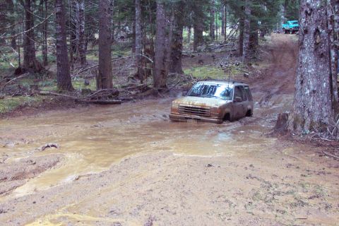 1996 Ford Bronco - But she had just a little too much momentum and water logged the air filter and stalls engine. (Slush pond - 2, GirlPower 4x4 - 0) Maybe ne…