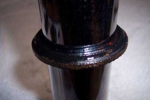 1973 Ford F-250 - A close-up view shows a black, cylindrical part with a raised, ribbed ring around its circumference. The ring appears to be coated in a dar…