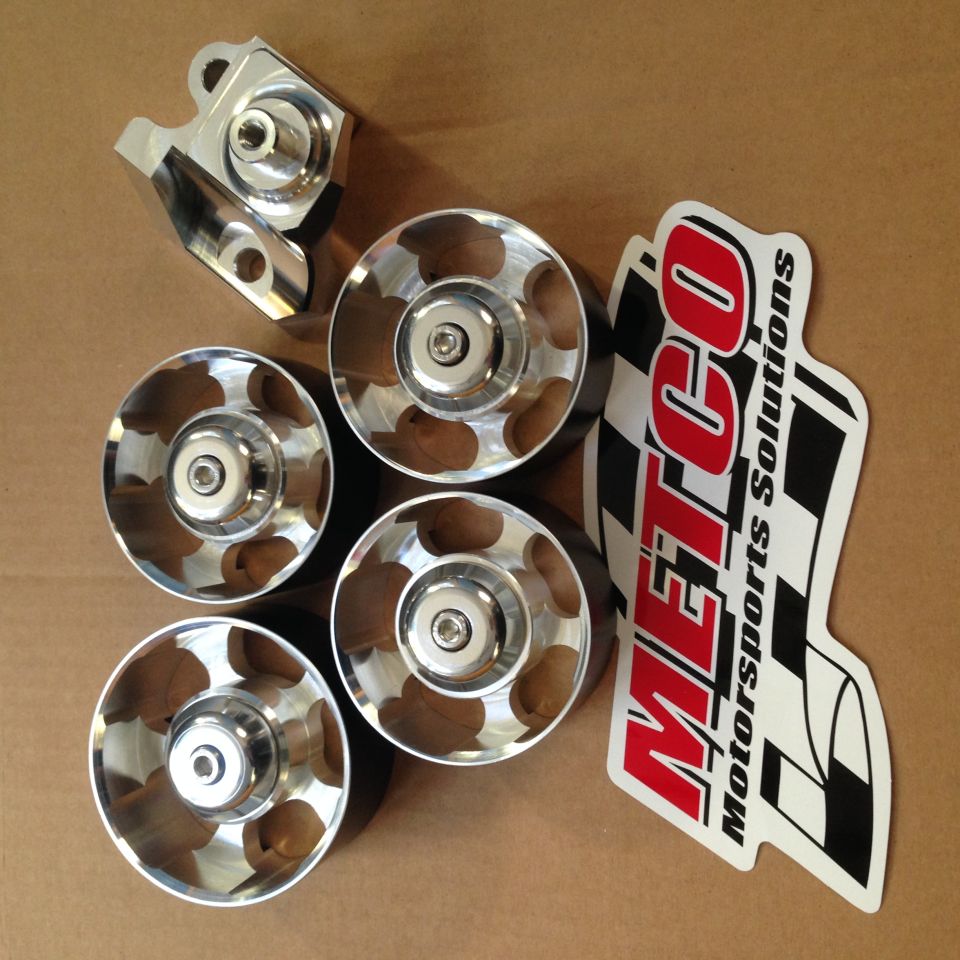 Polished metal pulleys and a bracket with a METCO Motorsports Solutions sticker.
