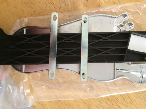 1964 Ford Ranchero - Detail of a black strap and metal buckles, likely an interior car component.
