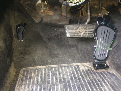 1964 Ford Ranchero - Close-up view of the driver's side floor area, showing the pedals and surrounding interior.