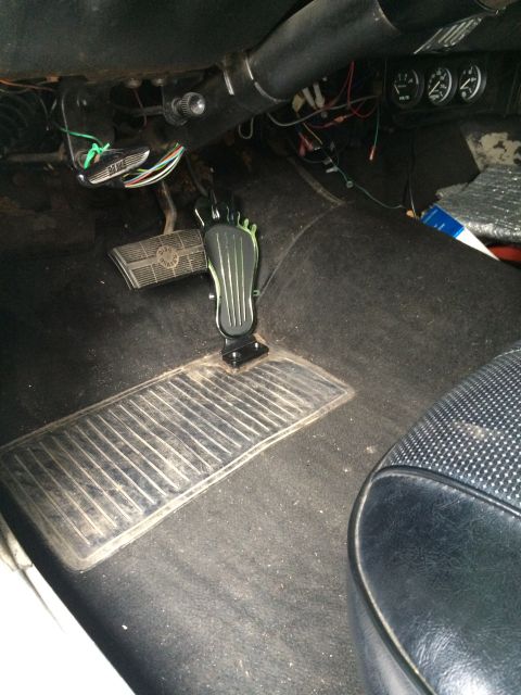 1964 Ford Ranchero - Close-up view of the floor pedals inside a vehicle's cabin.