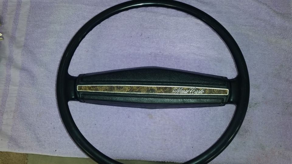 Black Monte Carlo steering wheel with wood grain accent