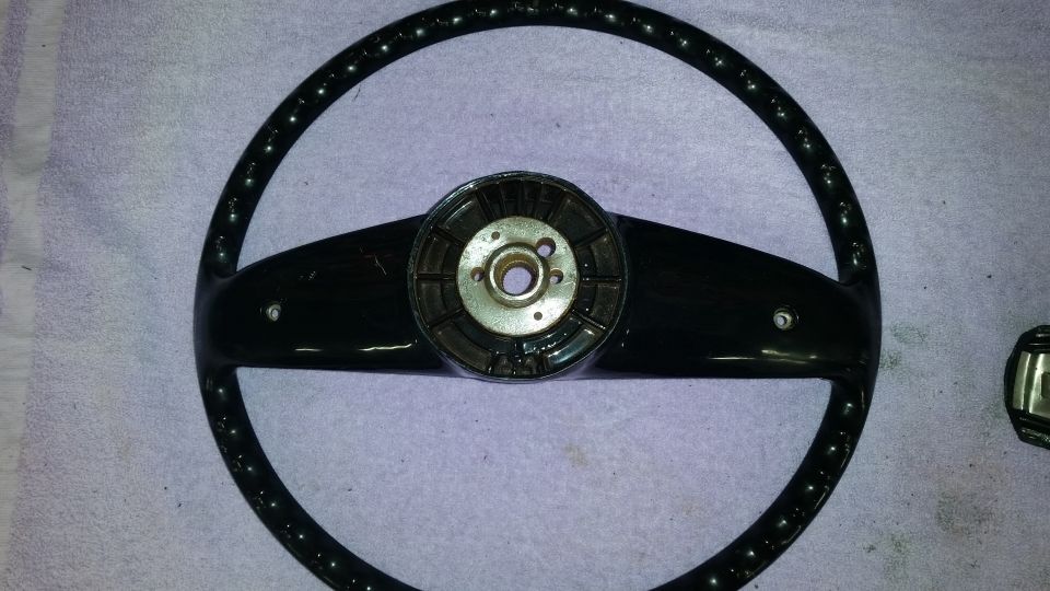 Black steering wheel with silver and black center hub