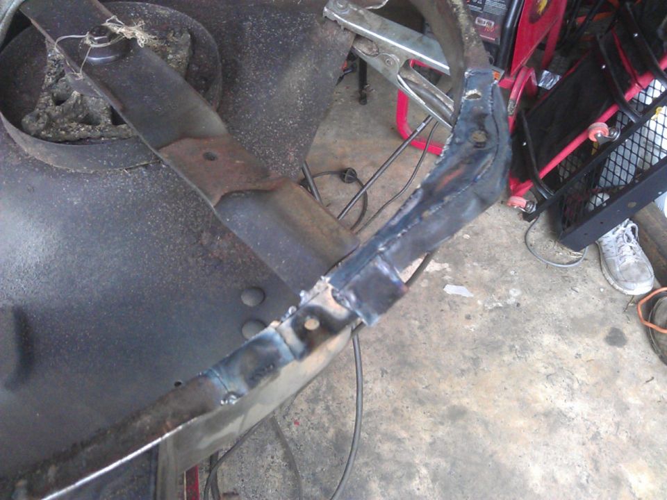Welded lawnmower blade and metal bracket
