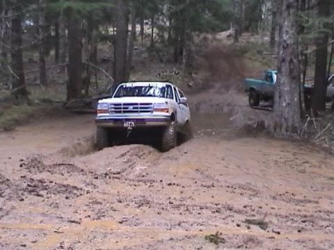 1996 Ford Bronco - Now that the hole has been pretty well cleaned out lets see if we can make it in 2 wheel drive. Yup! (by Anne) (2/21/2004)