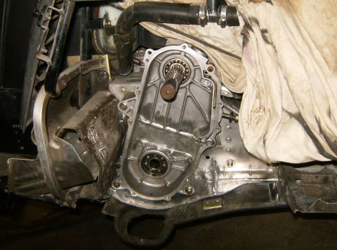 2000 Ford E350 - The image shows a close-up view of a vehicle's engine bay, focusing on the transmission housing and surrounding mechanical components. A di…