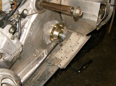 2000 Ford E350 - Snowmobile drive axle assembly with bearing housing and cable linkage visible.