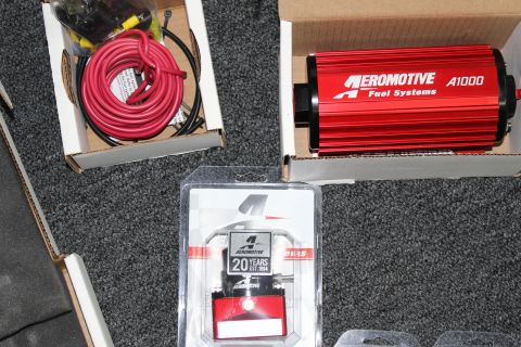 2003 Ford Crown Victoria - Red Aeromotive A1000 fuel pump and regulator kit with associated wiring.