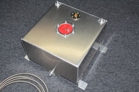 2003 Ford Crown Victoria - brushed aluminum fuel cell tank with a red cap fitting and mounting brackets, with braided line coiled nearby on gray carpet.