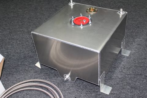 2003 Ford Crown Victoria - brushed aluminum fuel cell with red and brass top fittings and welded mounting tabs, with a coil of braided line beside it.