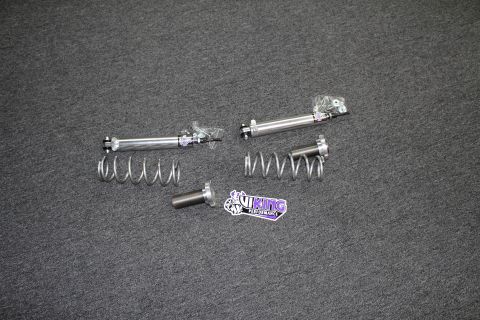 2003 Ford Crown Victoria - Two Viking shock bodies with packaged hardware, two coil springs, and a threaded billet sleeve beside a Viking Performance decal on gray ca…