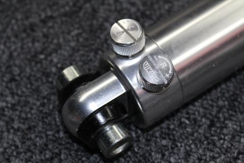 2003 Ford Crown Victoria - Close-up of a Viking shock absorber showing its two compression and rebound adjustment knobs marked R and L on the polished body.