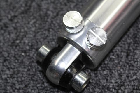 2003 Ford Crown Victoria - Close-up of a polished aluminum coilover shock showing two knurled Viking-branded adjustment knobs and the lower clevis mounting eye.