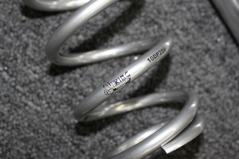 2003 Ford Crown Victoria - Close-up of a silver suspension coil spring printed with a Viking logo and the part number 10DP200.
