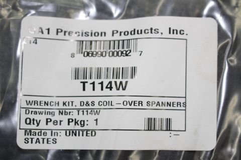 2003 Ford Crown Victoria - Parts package ID label showing barcode, UPC, and part number T114W for a coil-over spanner wrench kit.