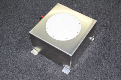 2003 Ford Crown Victoria - square brushed aluminum fuel cell with a white round twist cap and folded mounting tabs sits on gray carpet.