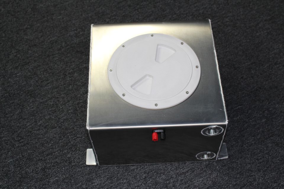 Aluminum fuel cell tank showing front face with fittings and red electrical terminal
