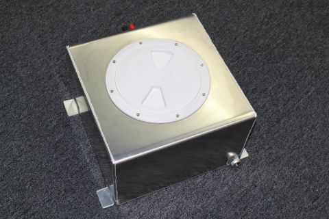 2003 Ford Crown Victoria - brushed aluminum fuel cell showing the white twist-lock cap on top and a threaded drain fitting at the lower front.