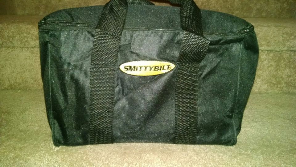 Black Smittybilt bag with yellow oval logo