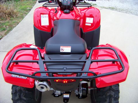 1984 Honda ATC 250 R - This red ATV has black racks on the front and rear, and a Honda logo visible on the back.