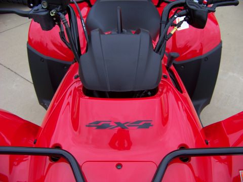1984 Honda ATC 250 R - Front view of a red ATV, showing the handlebars, front bodywork, and a 4X4 decal.