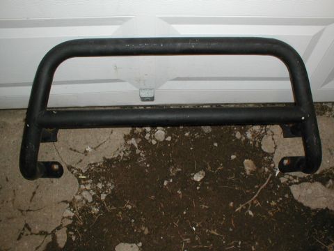 1979 Ford Bronco II - A black brush guard is shown, likely for an off-road vehicle, with mounting brackets visible.