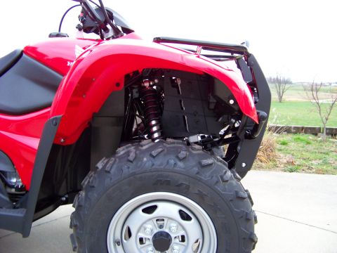 1984 Honda ATC 250 R - Close-up view of the front wheel and fender assembly of a red ATV.