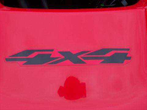 1984 Honda ATC 250 R - A close-up shows a 4x4 decal on a red background, with a small reflection below.