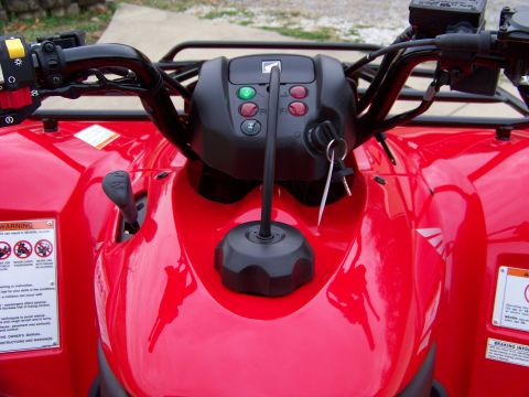 1984 Honda ATC 250 R - Close-up of the dashboard and controls of a red ATV.
