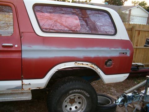 1979 Ford Bronco - This Ford Bronco shows signs of bodywork and rust, with its gas cap door ajar.