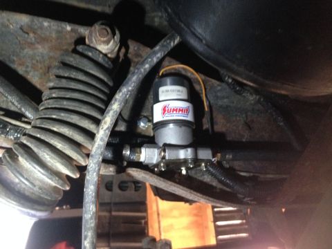 1979 Ford Bronco - A Summit Racing Equipment fuel pump is visible, mounted to the underside of a vehicle.