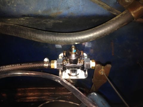 1979 Ford Bronco - Close-up of a fuel pressure regulator installed with braided fuel lines.