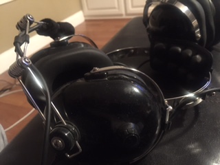 1986 Ford Bronco - A close-up view of a black RuggedRadio Intercom headset, chrome accents and plush earcups.