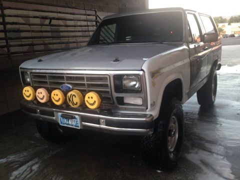 1986 Ford Bronco - This 1986 Ford Bronco is equipped with five KC lights, four with smiley faces and one with the KC logo.