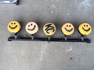1986 Ford Bronco - KC lightbar with smiley face covers and a "KC" logo cover.