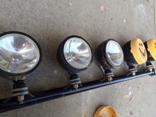 1986 Ford Bronco - A KC lightbar with four lights is shown, two of which have yellow protective covers.