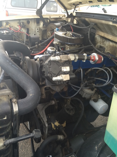 1981 Ford Bronco - Close-up view of a vehicle's engine bay, showing various components and wiring.