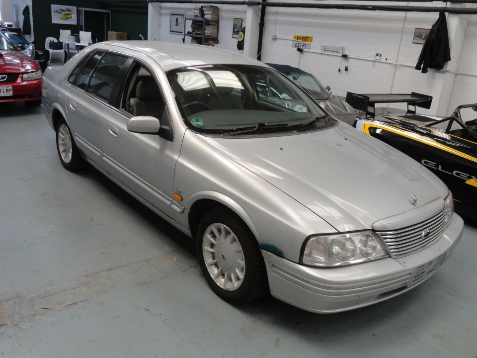 Silver sedan with a chrome grille and alloy wheels, seen from a 3/4 front angle