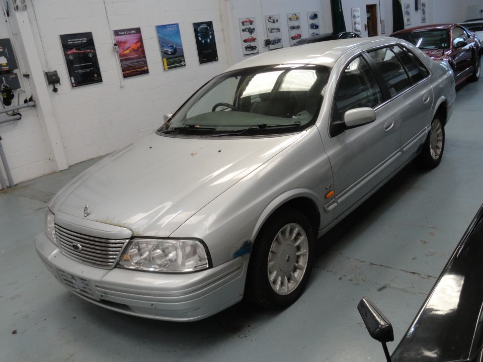 Silver sedan, 3q front view. Registry claims 1999 Ford Fairlane