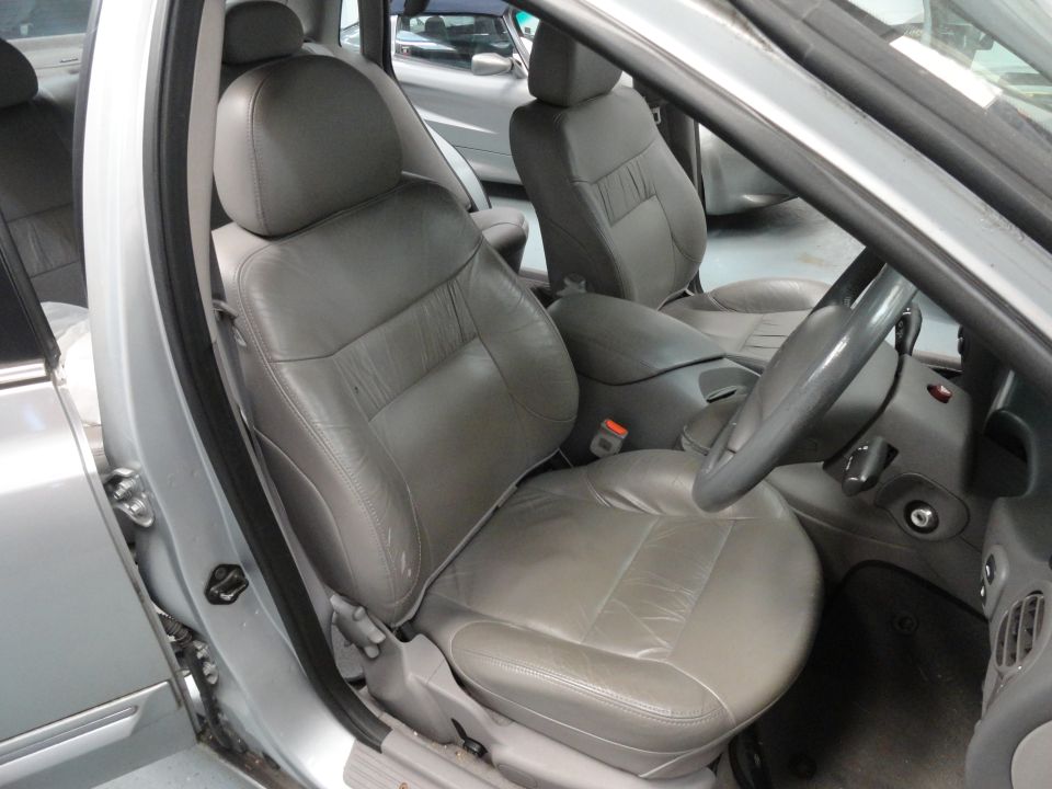 Gray leather seats and dashboard of a car interior