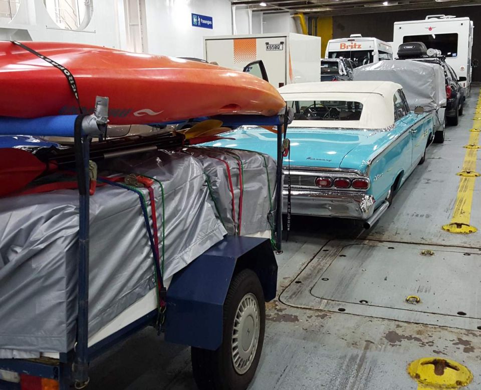 1964 Mercury Monterey convertible on a ferry deck.