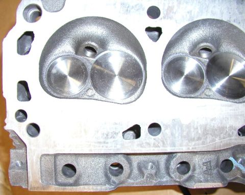 1988 Ford Bronco - Engine cylinder head showing intake and exhaust ports and valve seats.