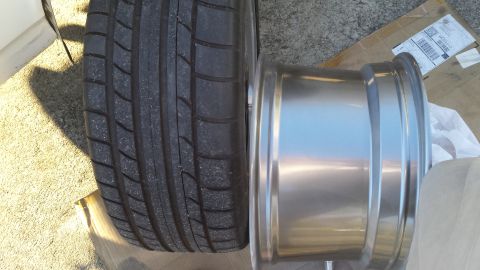 1976 Ford Ranchero - A close-up view of a tire and a shiny metal wheel rim.
