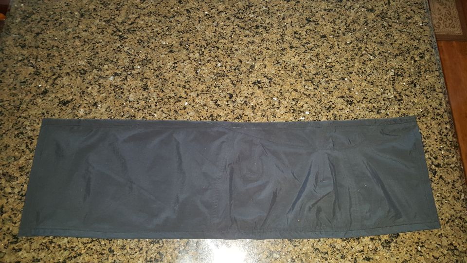 dark fabric mat on speckled countertop